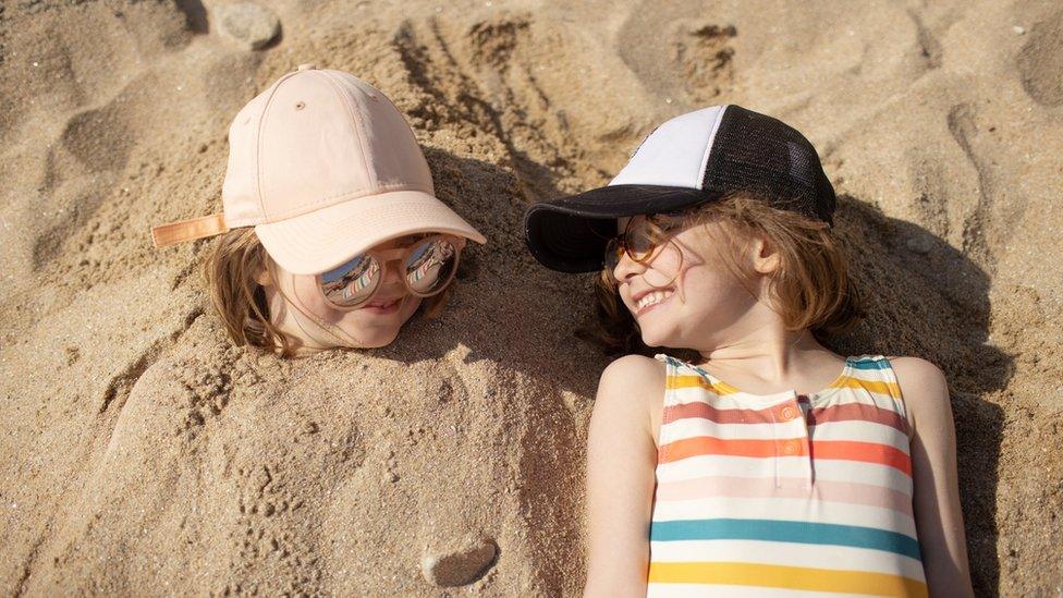 two-girls-in-sand.