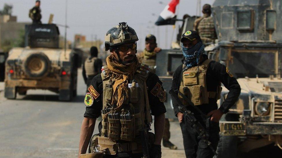 Iraqi forces are seen on 4 November, 2017 in the centre of the city of al-Qaim, in Iraq's western Anbar province after retaking it from Islamic State (IS) group jihadists a day earlier