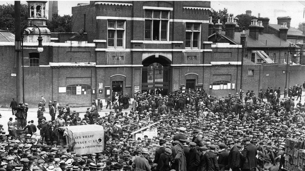 Workers congregate outside the Woolwich Arsenal during the strike of 1914