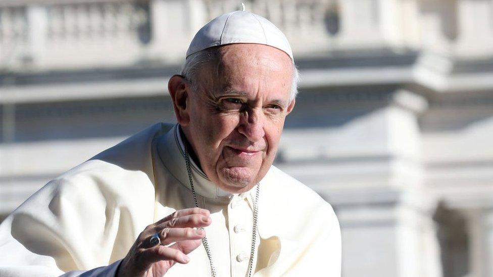 Pope Francis waves to the faithful as he arrives in St, Peter's square for his weekly audience on September 26, 2018 i