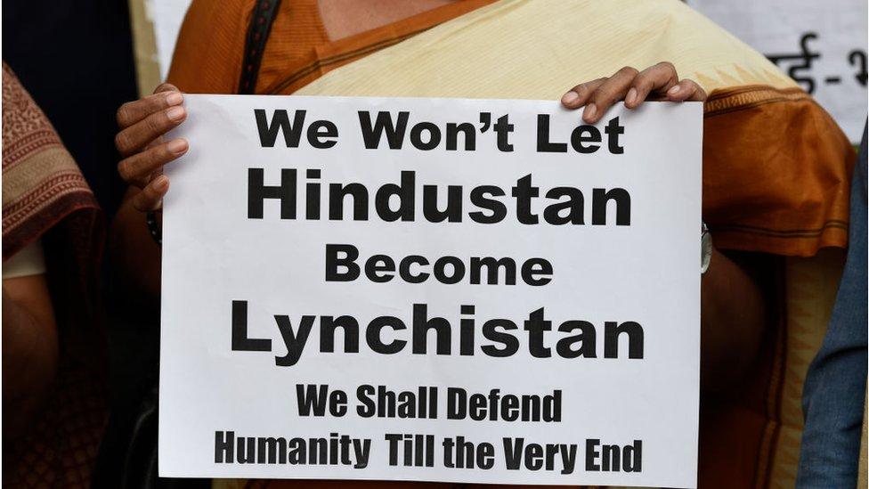 Members of All India Students Association (AISA) hold placards as they protest against the mob lynchings in the country, at Parliament street, on June 22, 2018 in New Delhi, India