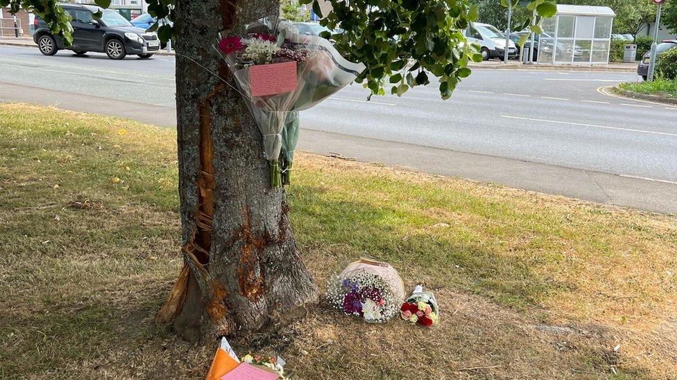 Flowers were left outside in tribute to her