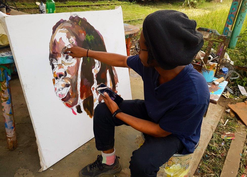 Man drawing on a canvas