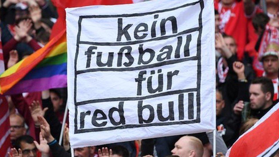 Bayern Munich fans hold a banner reading: 'Kein fussball fur Red Bull' (no football for Red Bull)