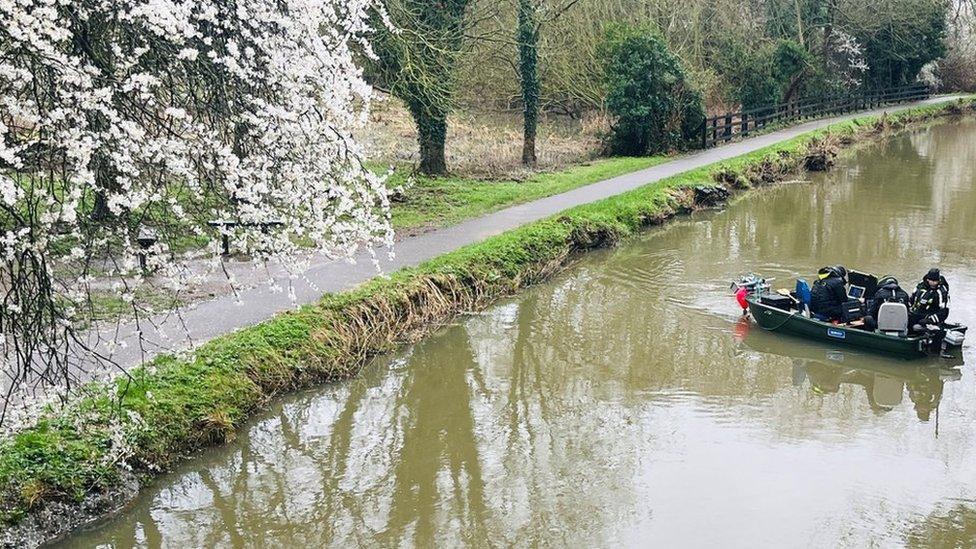 A search boat on the river