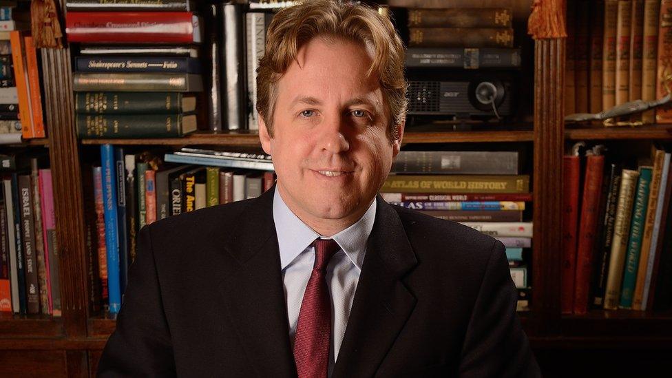 Marcus Fysh MP in his office with a bookshelf behind him