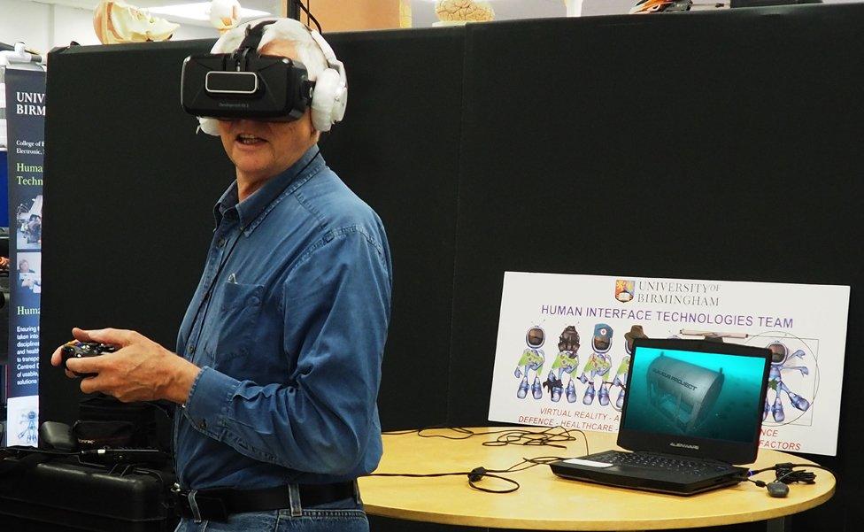 Irwin looks at a recreation of the Glaucus through a virtual reality headset