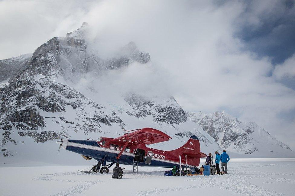 The team and their plane at the foot of the Citadel