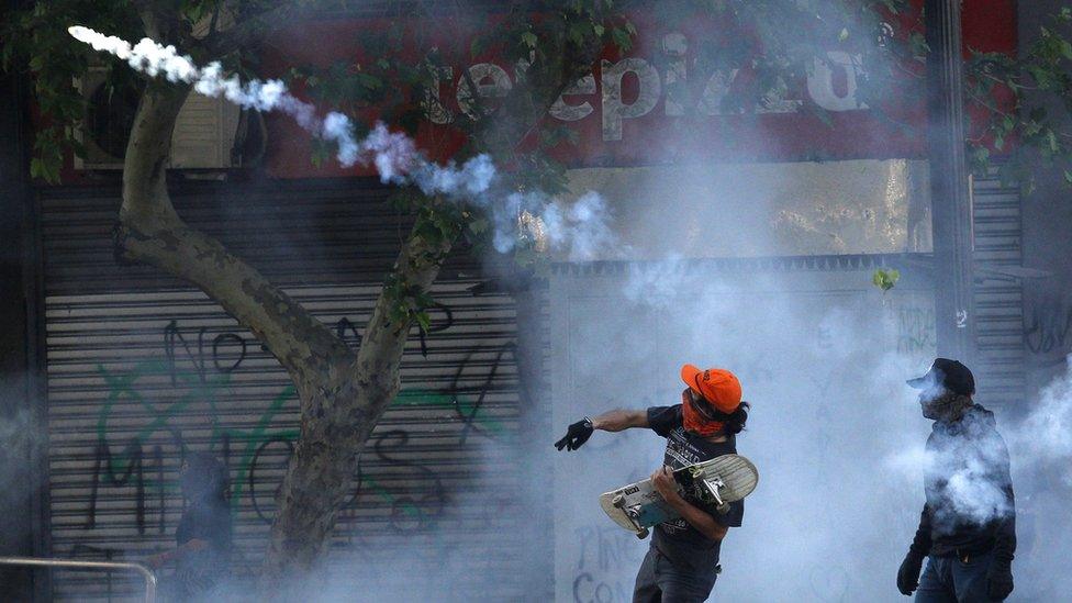 Two protesters launch projectiles