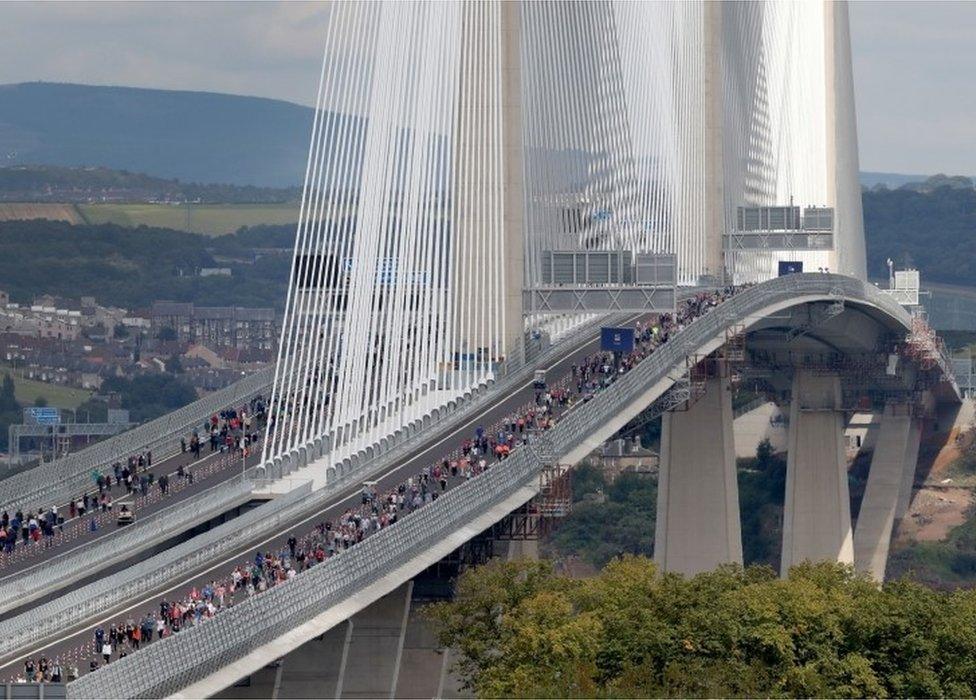 Walkers on bridge