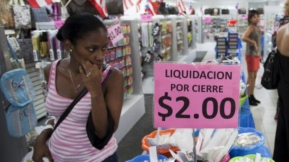 People shop in a store in San Juan, Puerto Rico (03 August 2015)