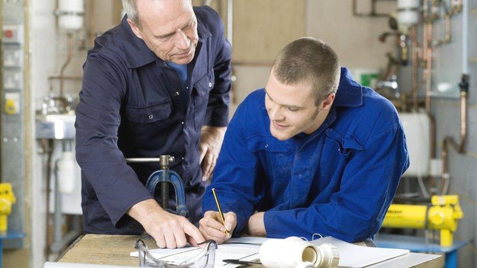 Plumber in workplace training