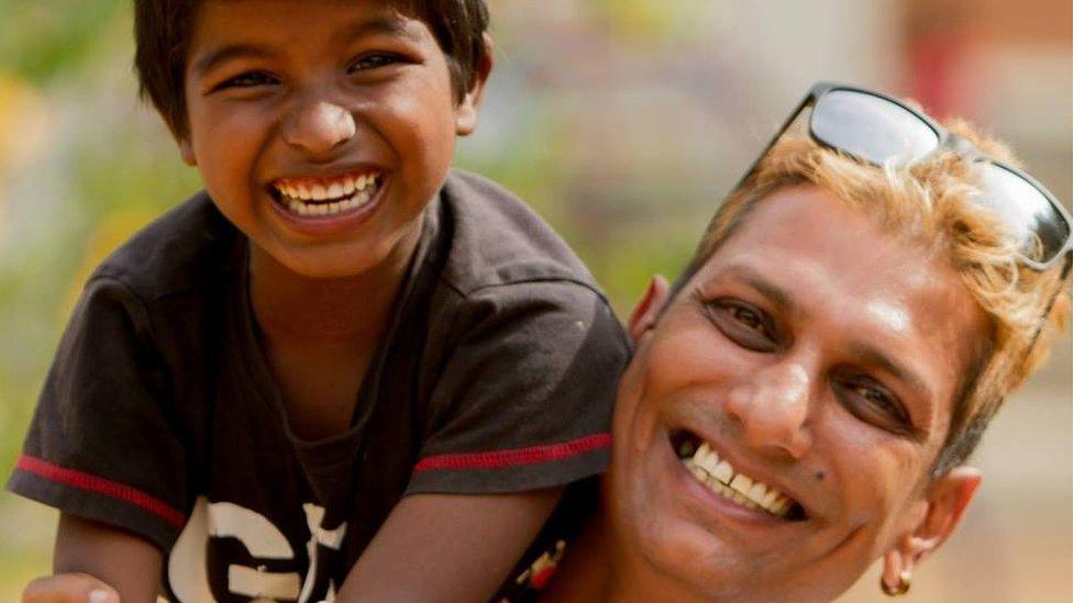 Mark Rego with one of the children from the Jeevarathni Foundation - a home for destitute children