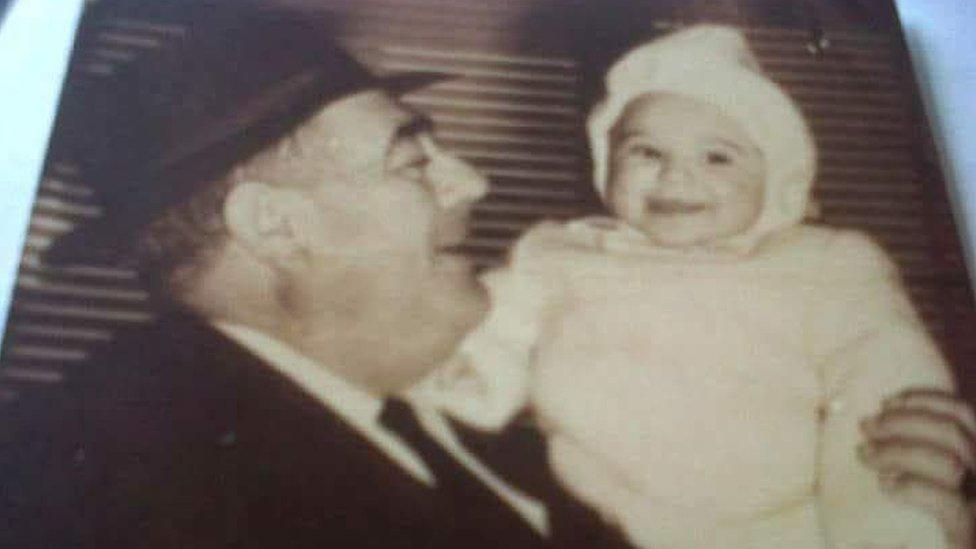 Ascension Lopez as a baby with her father