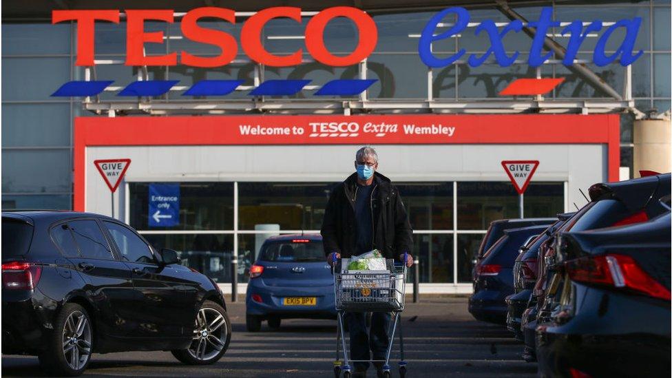 A shopper outside Tesco