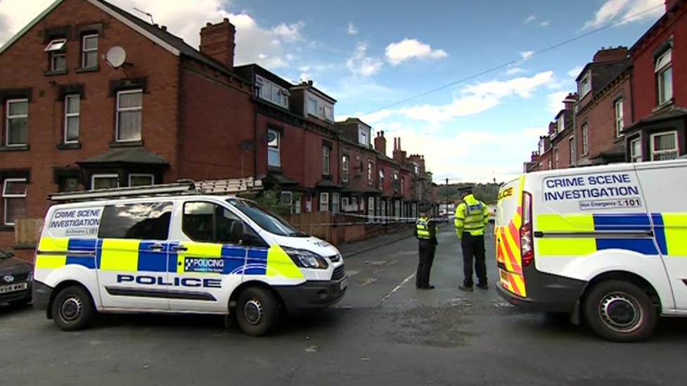 Police vehicles at the scene