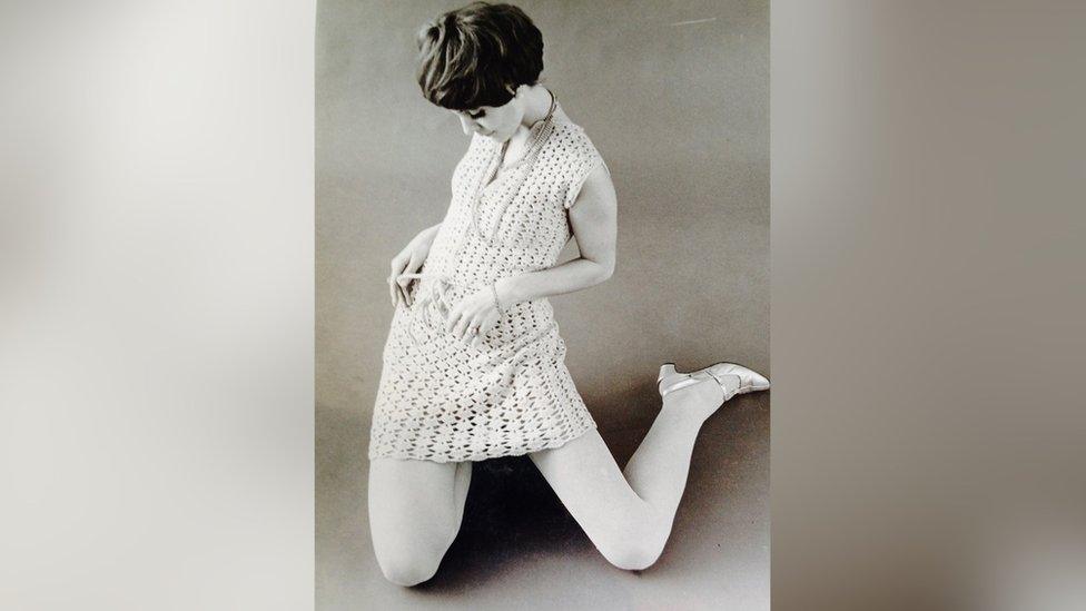 Mady in a knitted dress, modelling