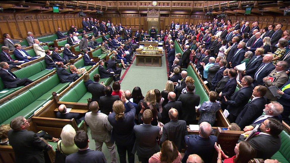 MPs standing in the House of Commons in support of an emergency debate