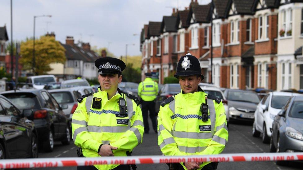 Police at the scene of the cordon over Harlesden Road