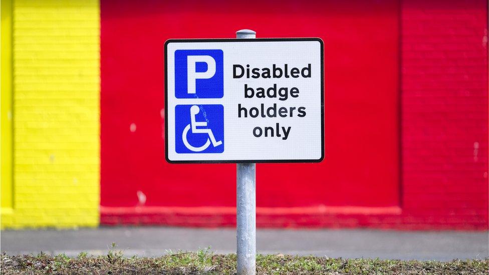 A sign reading 'disabled badge holders only'