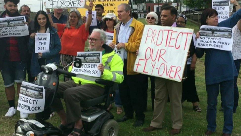 People protesting against the flyover plans