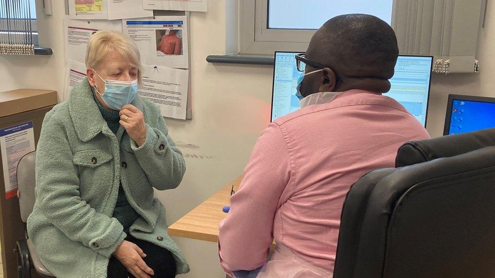 Patient Lynne Sleight being seen by a doctor