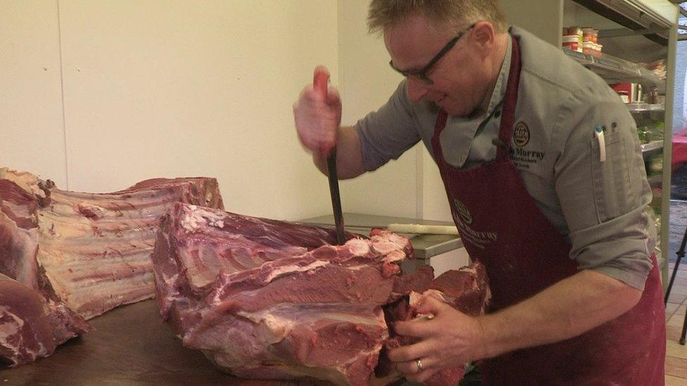 Alfie Murray preparing meat