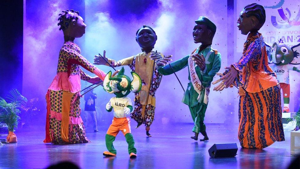 Giant puppets and Faro (2nd L), the mascot of the upcoming French Speakers"s Games (Jeux de la Francophonie), perform during the games" presentation at the Culture Hall in Abidjan on January 27, 2016