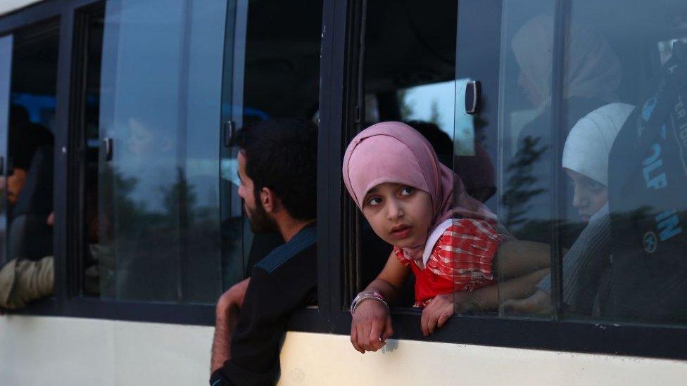 Syrian people from the city of Douma arrive in Al-Bab district of Aleppo, Syria on 11 April 2018