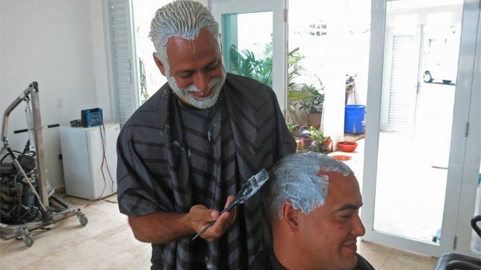 Two men who have dyed their hair blond in San Juan, Puerto Rico. Photo: 21 March 2017