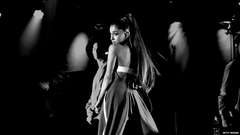 Black and white shot of Ariana performing