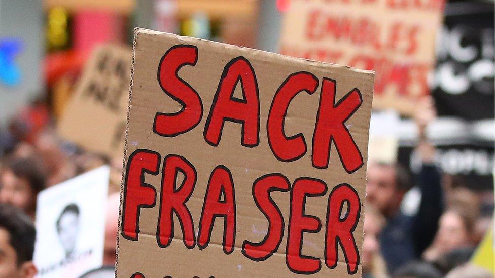 A protest sign at an anti-racism march in Melbourne reads: "Sack Fraser"