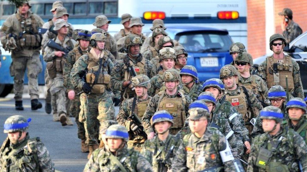 US and South Korean (blue head bands) marines take part in a US-South Korea joint landing operation in Pohang, South Korea (07 March 2016)