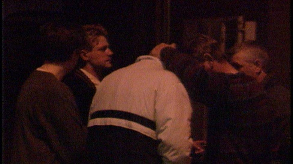 People gathered outside the bar in shock after the shooting