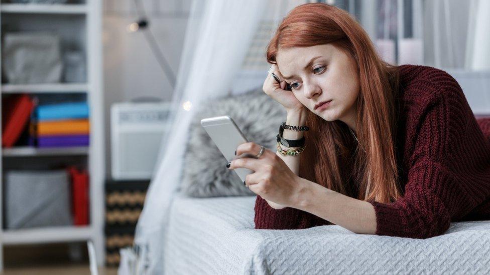 Young woman texting