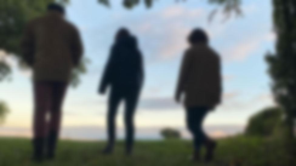 Blurred shot of family-of-three