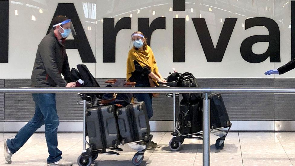 Passengers arrive at Heathrow airport