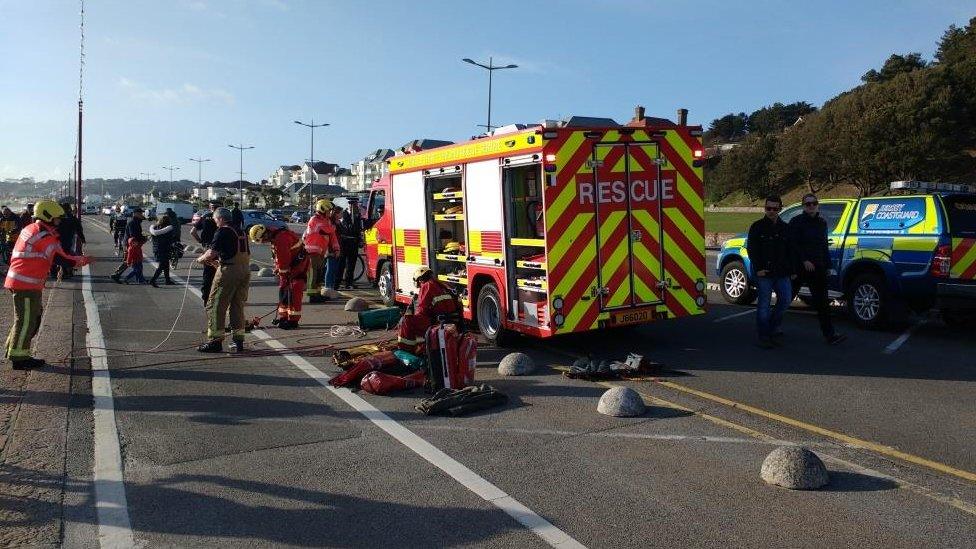 Firefighters preparing to rescue teenagers cut off by the tide