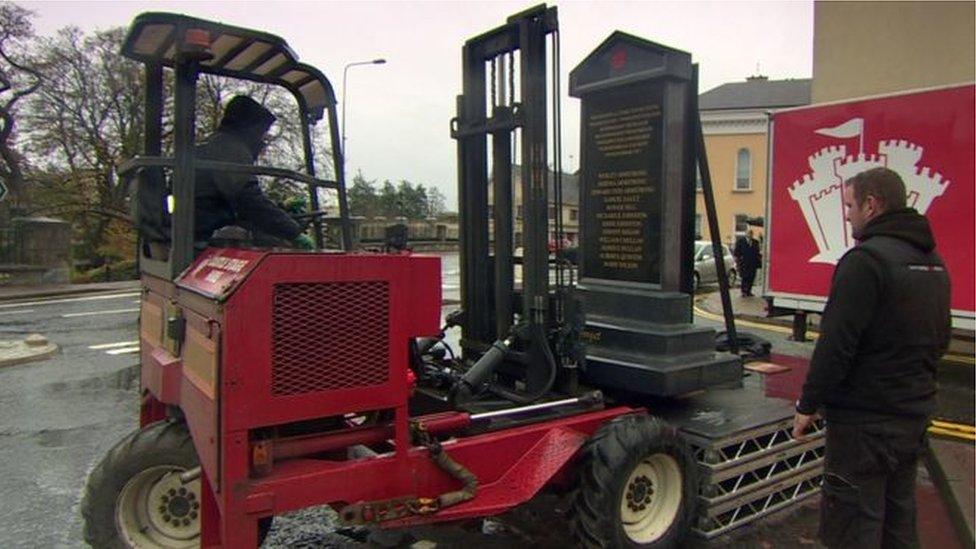 The memorial being removed and put into storage