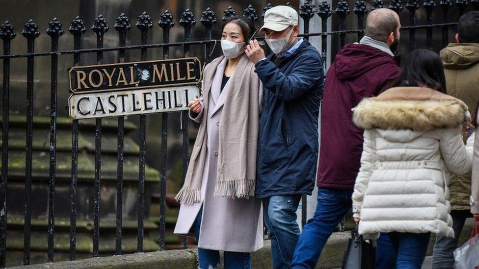 Tourists in masks in Edinburgh