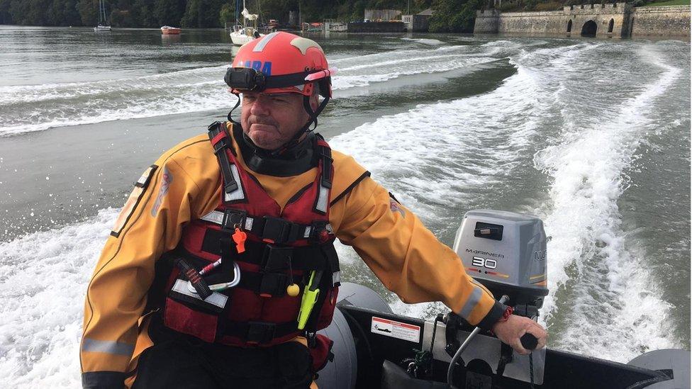 David Deveney skippering a small craft on the river Severn