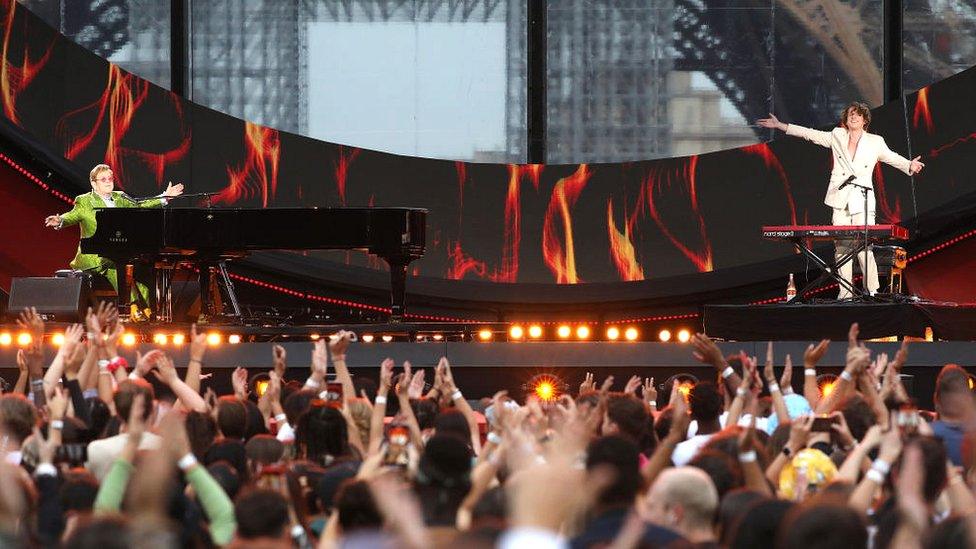 Elton John and Charlie Puth perform on stage during Global Citizen Live on 25 September 2021 in Paris, France