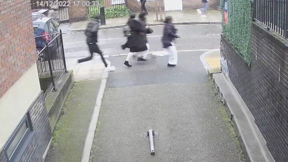 Group of people fleeing after shots fired outside a London church