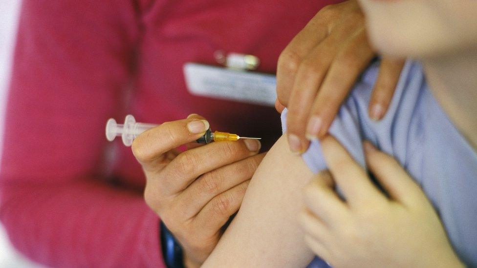 Stock photo of a child receiving their MMR vaccination