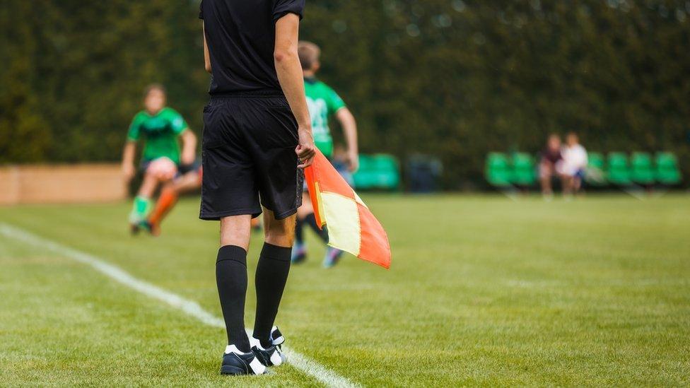 File photo of young linesman at football match