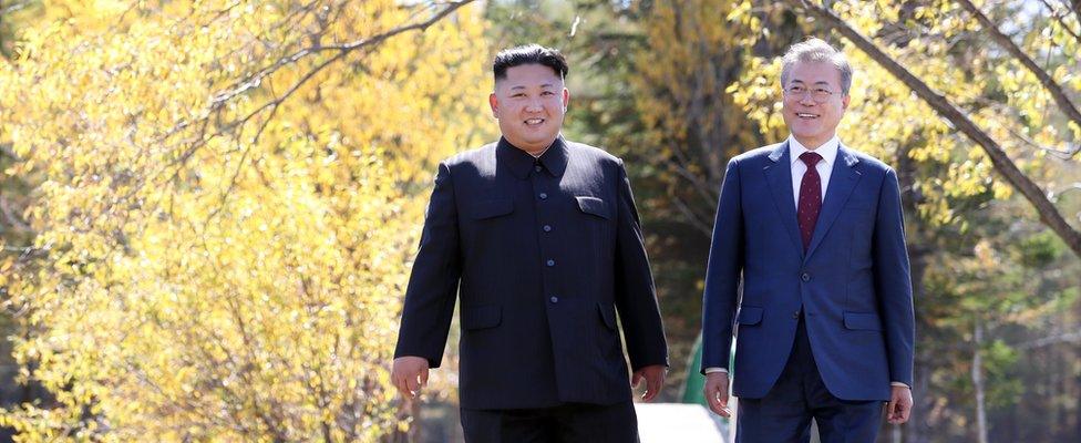 North Korea's leader Kim Jong Un (L) and South Korean President Moon Jae-in