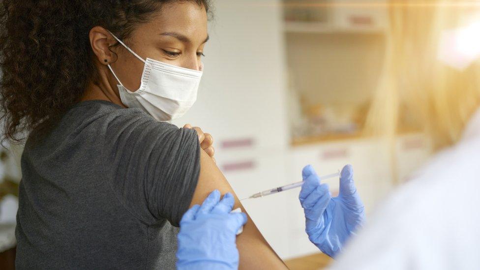 Young woman getting vaccinated