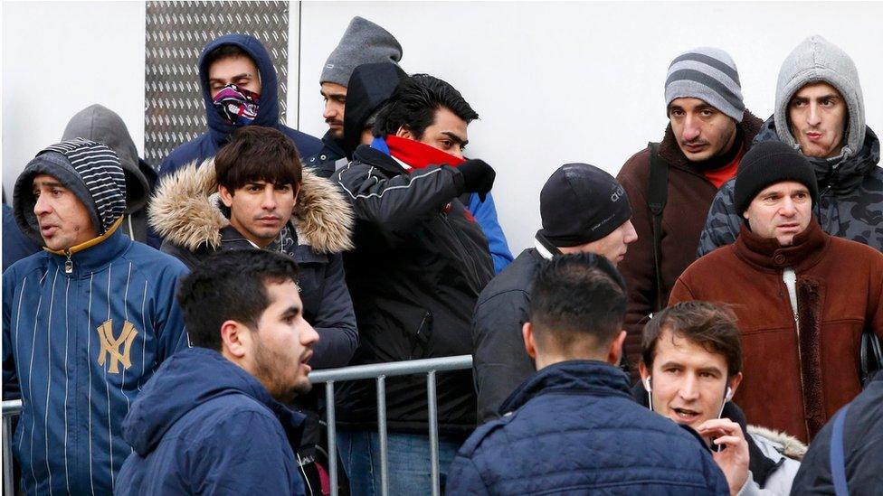 Migrants queue in front of a regional office for health and social affairs, Berlin (29 January)