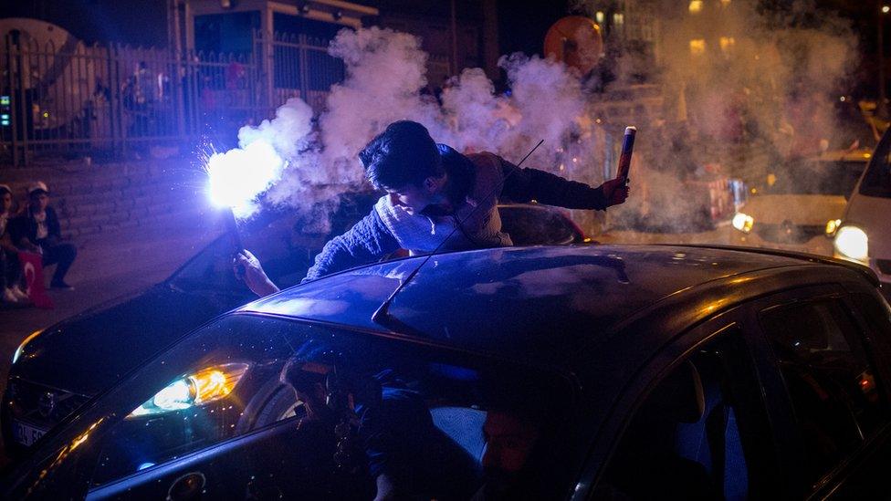 People celebrate the "Yes" result outside AK Party headquarters in Istanbul, Turkey, 16 April 2017