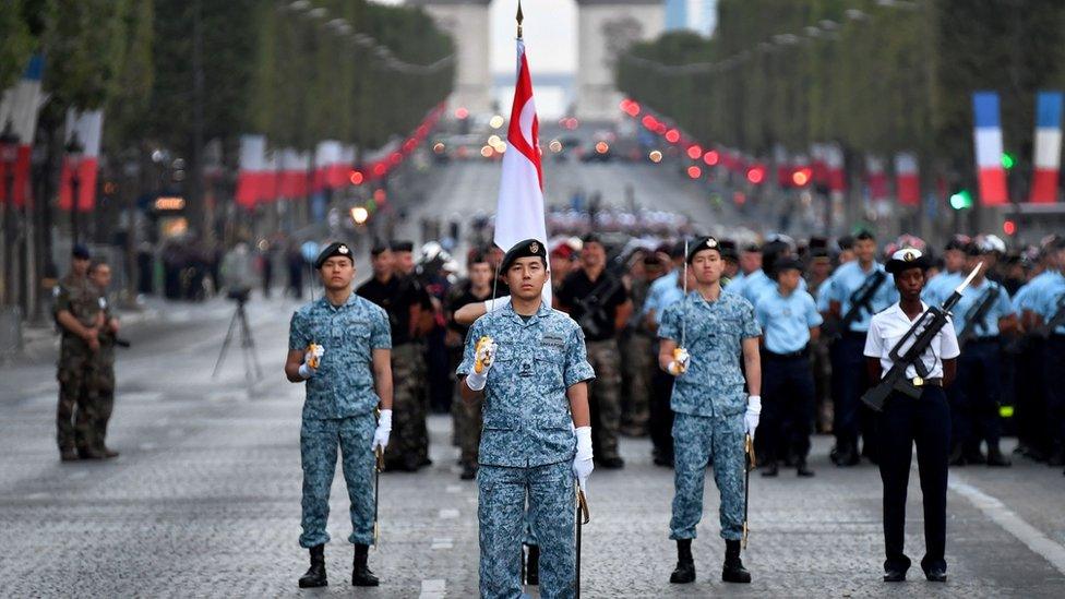 Singaporean troops parading in the boulevard